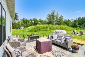 a patio with several chairs and a table and a table at Onamia Vacation Rental about 1 Mi to Mille Lacs Lake! in Isle