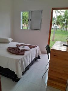 a bedroom with a bed and a table and a window at HOTEL POUSADA SÃO PEDRO MATÃO in Matão +131 photos