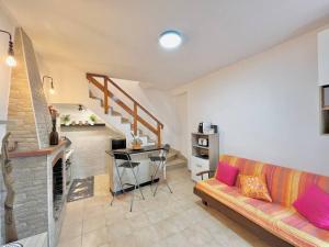 a living room with a couch and a fireplace at alloggio turistico Viaggiattori - lago di Bolsena in Valentano