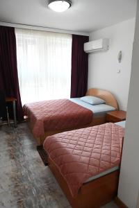 Voodi või voodid majutusasutuse Apartments Imper - IMD toas