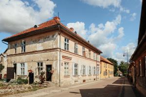 an old building on the side of a street at K&L Old Town Kuldīga in Kuldīga