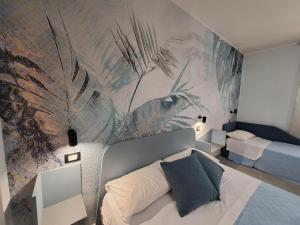 Postel nebo postele na pokoji v ubytování Azzurra Room