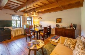 a living room with a couch and a table at Domček Ľúbezný in Banská Štiavnica