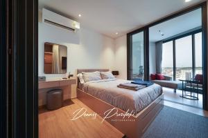 Ένα ή περισσότερα κρεβάτια σε δωμάτιο στο Edge Central Pattaya Seaview