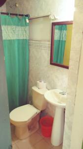 a bathroom with a toilet and a sink at ann dor place 1 in San Andrés