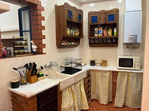Kuchyň nebo kuchyňský kout v ubytování Casa do Viajante