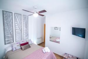 Ένα ή περισσότερα κρεβάτια σε δωμάτιο στο Naïsa apartamento turístico