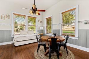 a living room with a table and chairs and a couch at #14 The Country Suite at Garrison in Gruene in New Braunfels