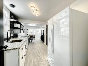 a kitchen with a sink and a counter top at Family-friendly 2br Wi-fi Pets Near Disney in Orlando