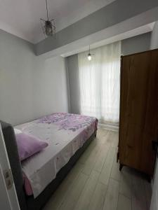 Postel nebo postele na pokoji v ubytování lotus tatil köyü
