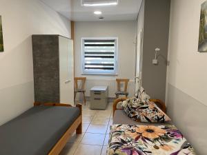 a small room with two beds and a desk at Stumpf Verpachtung Gbr in Treuchtlingen +102 photos