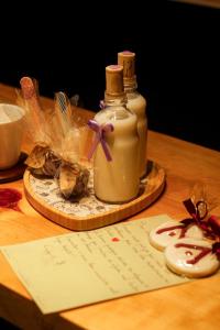 a table with two bottles of soap and a paper at Cabana The Wild Urubici in Urubici +16 photos
