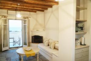 a living room with a couch and a table at Bella Vista in Naousa