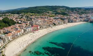 サンシェンショにあるApartamento en 1ª línea de Playa Silgar con vistas al mar y parking privadoの海辺の空中の景色