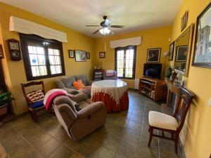 a living room with a couch and a table at Casa Santa María by CasaTuristica in Ronda