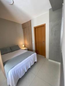 Ένα ή περισσότερα κρεβάτια σε δωμάτιο στο Apartamento Studio Completo - próximo à Savassi
