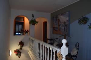 a staircase in a home with flowers on the wall at Brussa 340 in Brussa