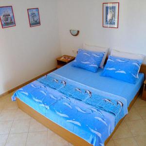 Postel nebo postele na pokoji v ubytování Apartments Ana