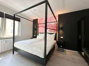 Postel nebo postele na pokoji v ubytování City Apartment with WIFI, Kitchen and 4K TV