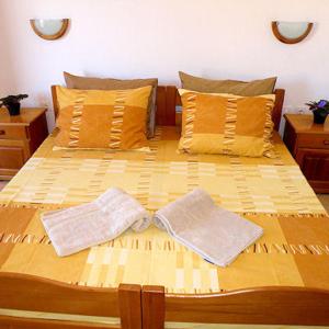 Postel nebo postele na pokoji v ubytování Apartments Ana