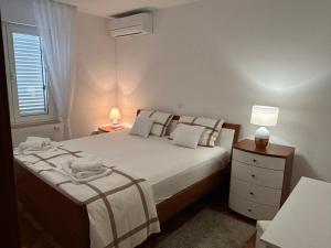 Posteľ alebo postele v izbe v ubytovaní Apartment Tina