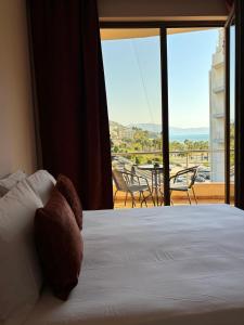 Postel nebo postele na pokoji v ubytování Hotel Vlora 78