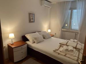 Posteľ alebo postele v izbe v ubytovaní Apartment Tina