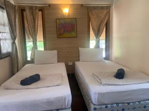 Rúm í herbergi á Seashell Resort Koh Tao-SHA Plus
