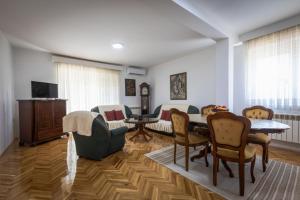 Un televizor și/sau centru de divertisment la Rosi Apartment