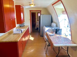 a kitchen with red cabinets and a counter top at Lakeview Terrace Resort in Lewiston