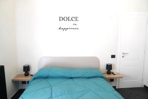 Ένα ή περισσότερα κρεβάτια σε δωμάτιο στο Dolce Apartments Castel Gandolfo