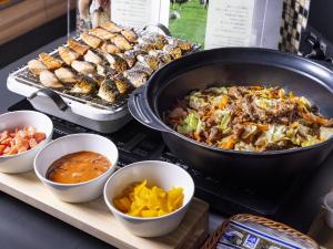 a buffet with a lot of food on a table at Tokyu Stay Sapporo Odori in Sapporo