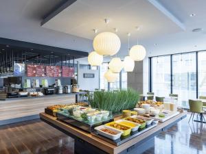 a buffet of food on a table in a restaurant at Tokyu Stay Sapporo Odori in Sapporo