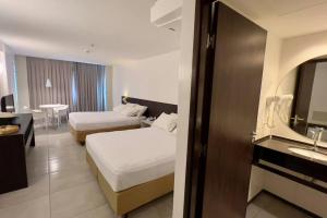 Postel nebo postele na pokoji v ubytování Hotel Ritz Suítes | Flat632 | Quarto com Vista mar