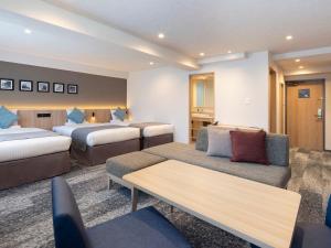 Postel nebo postele na pokoji v ubytování HOTEL MYSTAYS Iidabashi