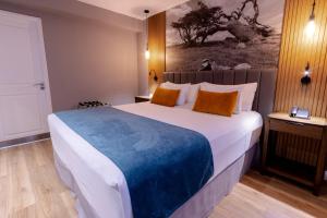 Cama ou camas em um quarto em Alto Andino Hotel