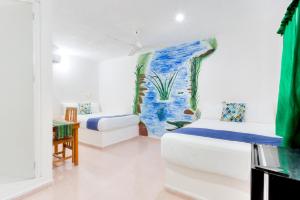Postel nebo postele na pokoji v ubytování HOTEL LAS COLORADAS