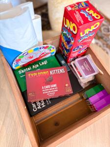 a wooden tray with snacks and other items on it at Citadines Gatot Subroto Jakarta in Jakarta
