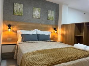 Postel nebo postele na pokoji v ubytování Provenza Medellin Hotel Boutique