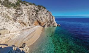 an aerial view of a beach next to the ocean at Solis in Brseč