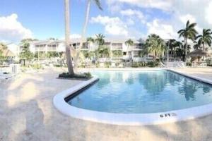 a swimming pool in front of a resort at KAWAMA L4 in Key Largo, Beach, Lagoon, Pools, Tennis and Free Bikes in Key Largo