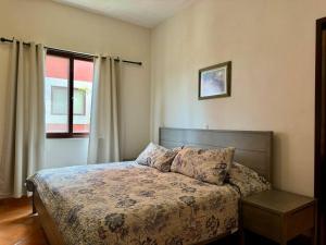 a bedroom with a bed and a window at Charming No Stairs Near DT Security Pool Parking in San Miguel de Allende +46 photos