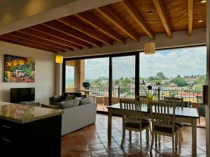 a living room with a couch and a table at Charming No Stairs Near DT Security Pool Parking in San Miguel de Allende