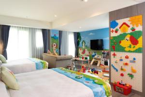Postel nebo postele na pokoji v ubytování E-DA Skylark Hotel