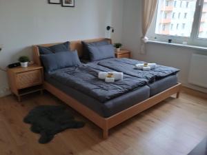 a bedroom with a bed with two candles on it at Oase Coswig Ferienwohnung in Coswig