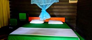 Postel nebo postele na pokoji v ubytování Jungle Cabin - Bundala