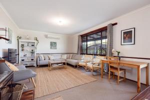 a living room with a couch and a table at Roo With A View By Swan Bnb Management in Preston Beach