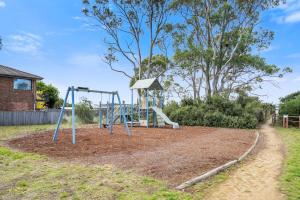 a playground with a slide in a yard at Beach Holiday Home-Close to Airport-3 Bed & 2 Bath in Lauderdale