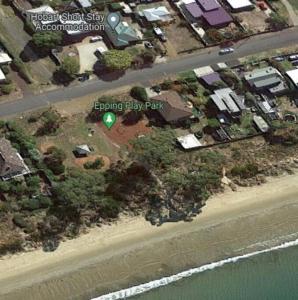 an aerial view of a beach with a green balloon at Beach Holiday Home-Close to Airport-3 Bed & 2 Bath in Lauderdale