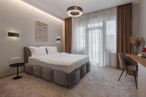 Postel nebo postele na pokoji v ubytování Oasis Rooms